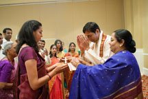 Washington DC Indian wedding photographers catching groom welcome by bride's family